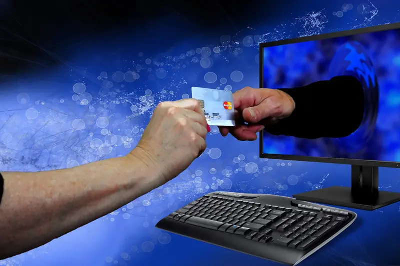 Bankkarte und Bildschirm, Symbol für Online-Banking-Betrug